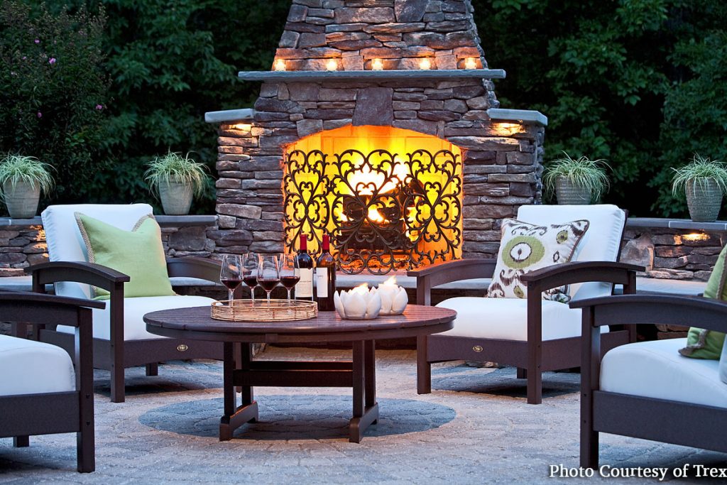 Outdoor living space with fireplace and furnishings